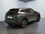 the rear view of a grey suv parked in a garage