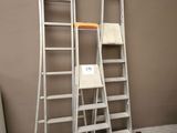 two ladders that are standing next to each other