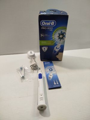 a box of toothbrushes sitting on a table next to a package of toothpaste