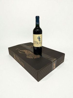 a bottle of wine sitting on top of a box