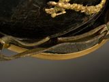 a black hat with a gold cross on it