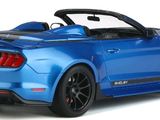 the blue mustang convertible is parked in front of a white background
