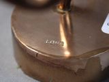 a close up of a brass plate with a label on it