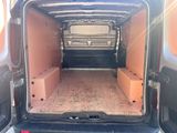 the back of a van with the doors open and boxes in the back