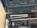 someone standing next to a tool box with tools in it
