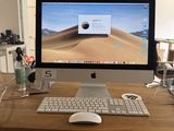 a computer on a desk with a keyboard and mouse