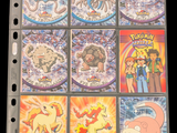 a lot of pokemon cards on a binder