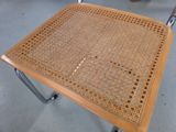 a table that has a metal frame on it
