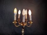 five candles that are lit up on the table