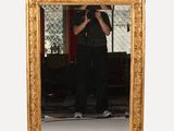 a man taking a picture of himself in a mirror