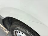 a close up of a white car with a flat tire