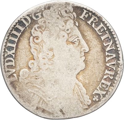 une pièce d'argent sur laquelle figure le portrait d'une femme