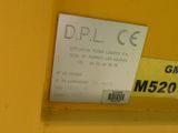 a label on the side of a yellow machine