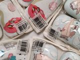 a lot of baby shoes that are in a bag