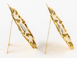 pair of gold plated earrings with flowers and leaves on them