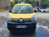 a yellow van that is parked in a parking lot