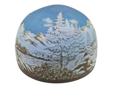a picture of a painted egg with a mountain scene on it