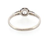 a close up of a diamond ring on a white background