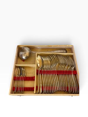 a wooden tray with silverware in it on a white surface