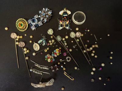 many different types of jewelry on a black surface