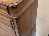 a wooden desk with a drawer on top of it