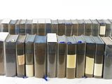 a lot of books stacked on top of each other