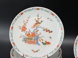 several plates with different designs are stacked on top of each other