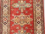 an oriental rug with a red and blue design on it