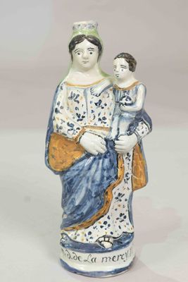 a figurine of a woman holding a child