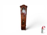 a grandfather clock that is standing on a white surface