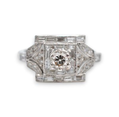 a close up of a diamond ring on a white background