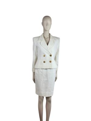 an image of a mannequin wearing a white suit and skirt
