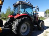 a tractor that is parked on the side of the road