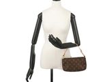 louis vuitton brown monogramet shoulder bag on a mannequin dummy