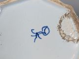 a blue and white plate with a blue bird on it