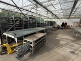 a room with a lot of shelves and tables inside of it