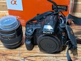 a camera and two lenses on the table