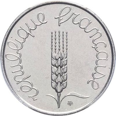 a close up of a silver coin with a wheat on it