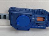 a blue and orange toy gun on a white surface