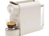 une image d'une machine à café avec une tasse de café