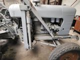 a tractor that is parked in a garage