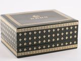 a black and gold box with gold trimmings on it