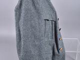 an image of a coat with red buttons on a mannequin