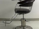 an image of a barber chair in the middle of a room