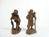 pair of carved wood figures of a man and a woman
