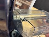 a hand holding a blender that is sitting on a table