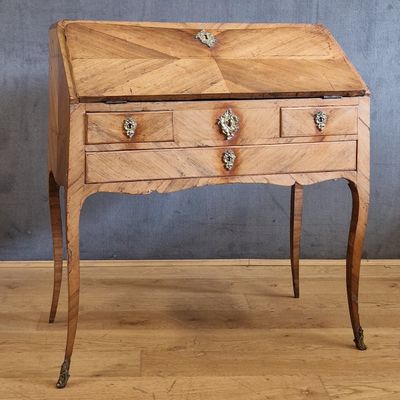 an old wooden desk with two drawers and a drawer on top of it