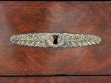 an image of a wooden drawer with a lock on top of it