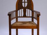 an image of a wooden chair with a woven seat and back rest