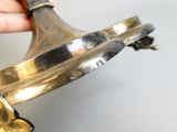 a person holding a metal object in their hand